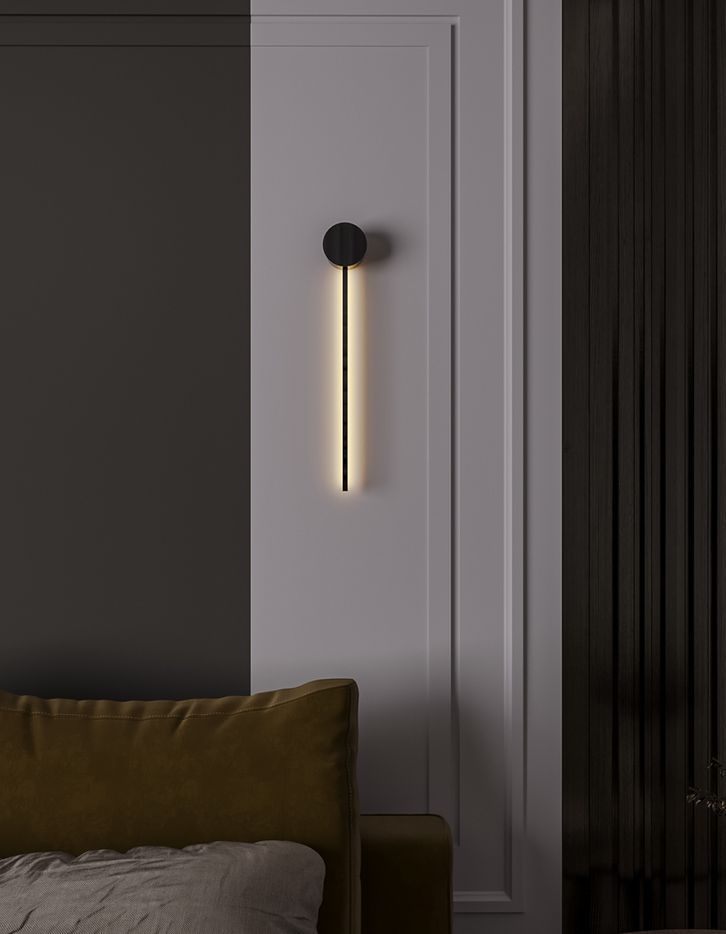Black wall lamp with linear lines and circular element creating soft indirect light / مصباح حائط أسود بخطوط هندسية ودائرة يبعث إضاءة غير مباشرة ناعمة