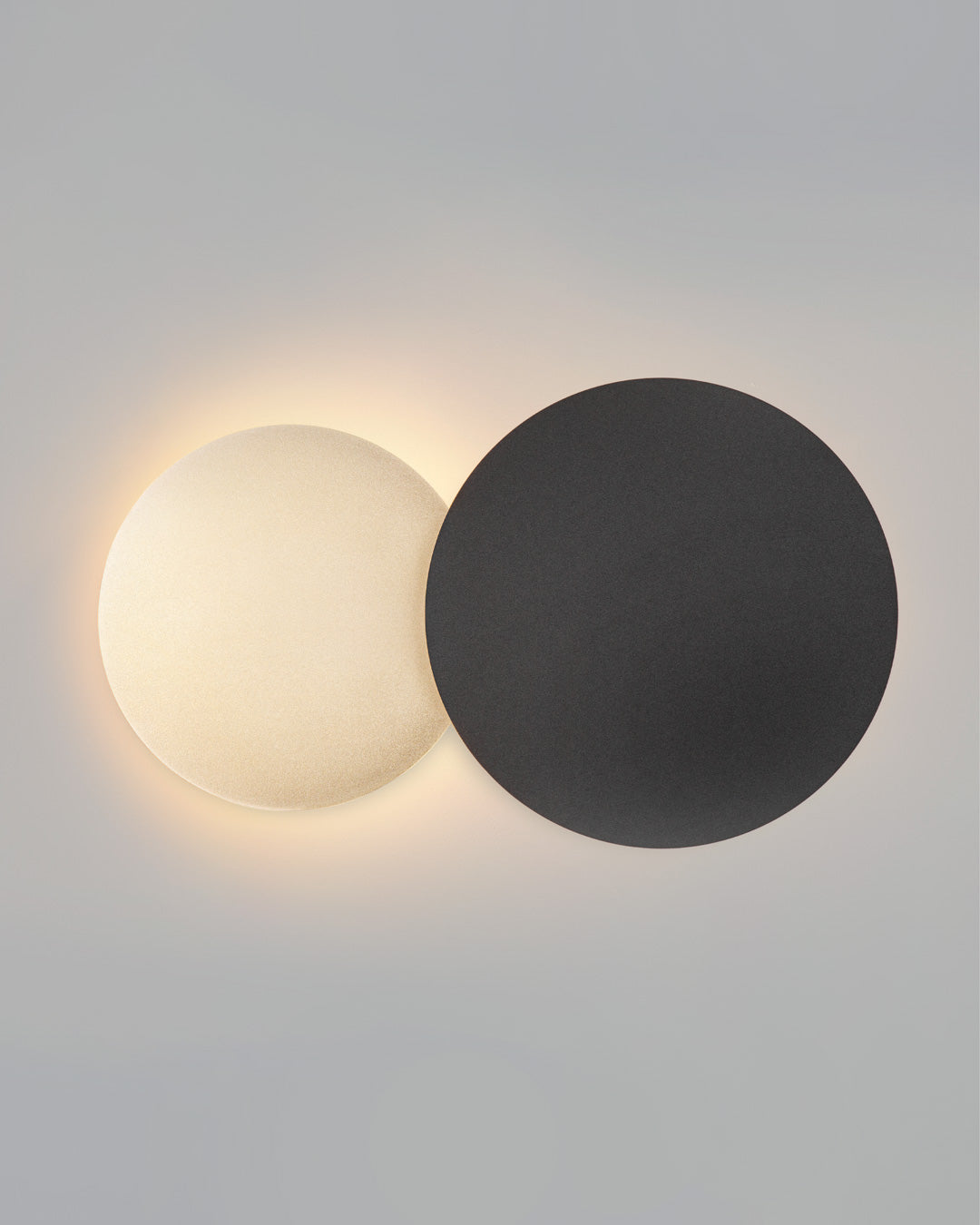 Dual circle wall lamp with indirect glow creating a modern decorative accent / مصباح حائط بدائرتين متناسقتين يبعث إضاءة غير مباشرة بطابع عصري