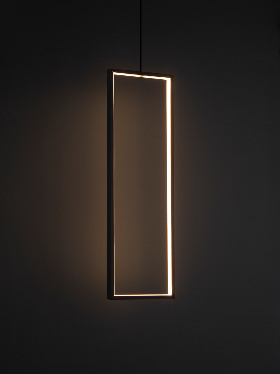 Bound pendant light with suspended modern form emitting warm ambient glow / إضاءة معلقة بتصميم معلق عصري تبعث توهجًا دافئًا يضيف لمسة أنيقة