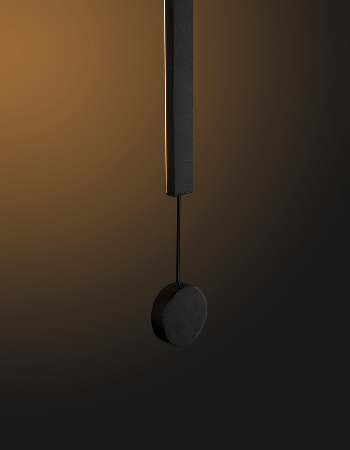 Lines pendant light with slim vertical black design creating warm ambient lighting / إضاءة معلقة بتصميم خطي نحيف باللون الأسود تضيف إضاءة دافئة ولمسة عصرية